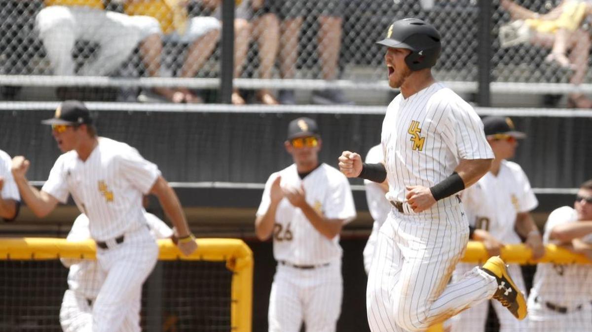 Dylan Burdeaux of Southern Miss celebrates as he scores the first Golden Eagle run during Southern Miss-UIC baseball game at the Hattiesburg Regional Tournament on June 2.