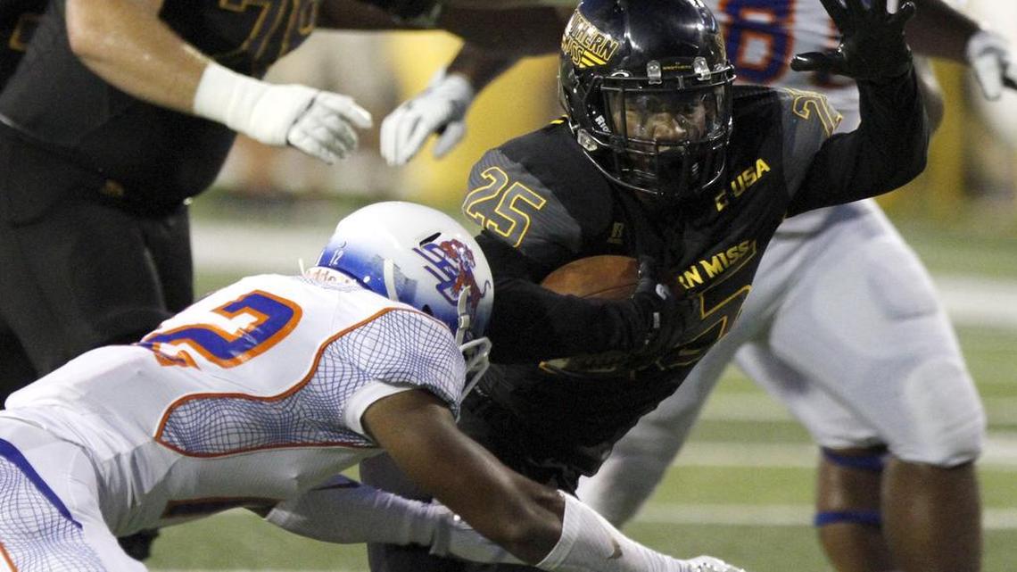 Southern Miss running back Ito Smith makes a hard cut to reach a first down against Savannah State.