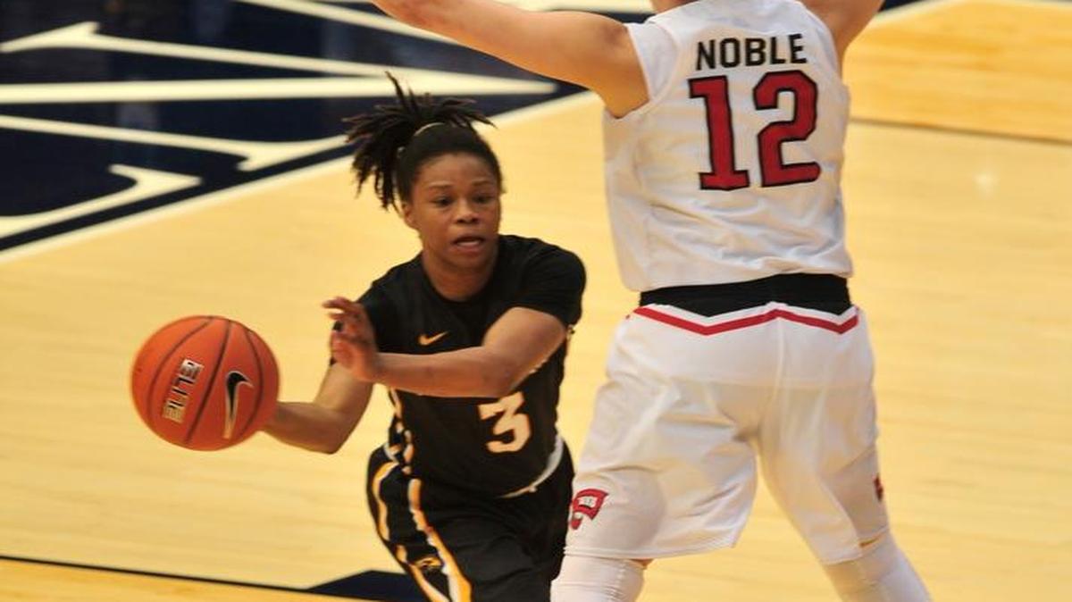 Southern Mississippi's Keri Jewett-Giles, left, looks to pass around Western Kentucky's Kendall Noble in the championship of the Conference USA women’s tournament, Saturday.