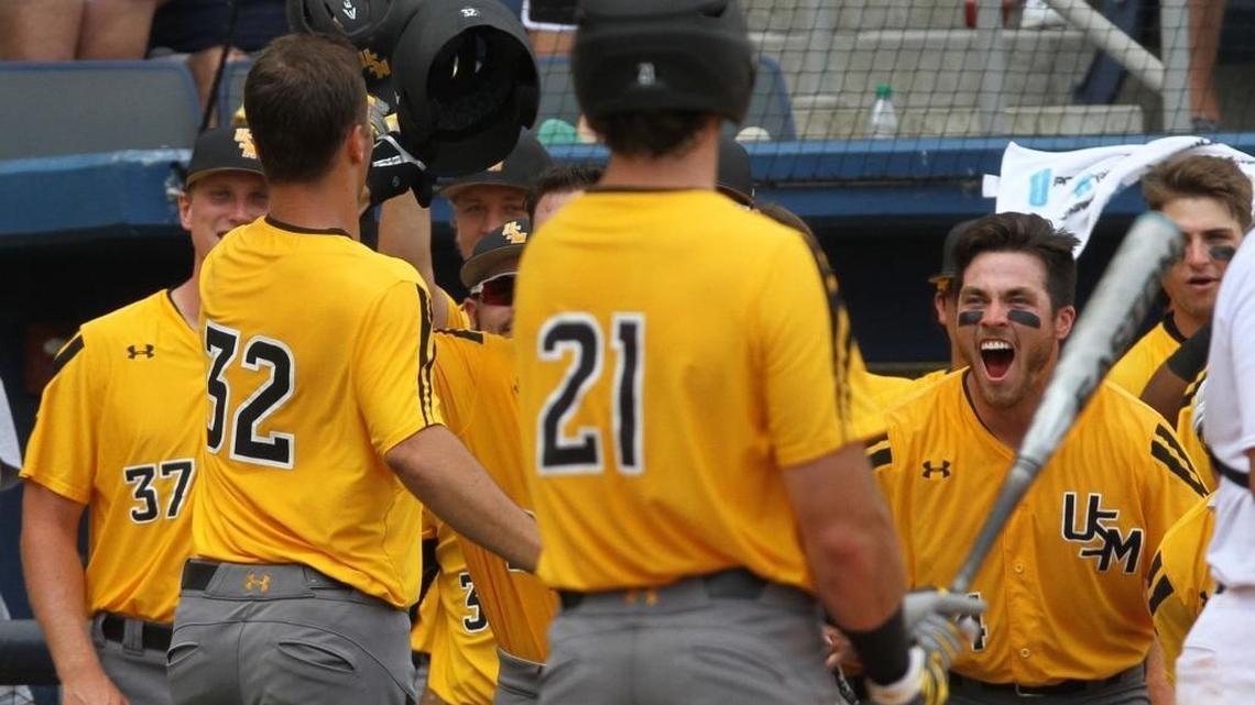 Southern Miss players greet Matt Wallner (32) after he hit a solo home run against Rice during the fourth inning of their C-USA tournament championship game at MGM Park in Biloxi on Sunday.