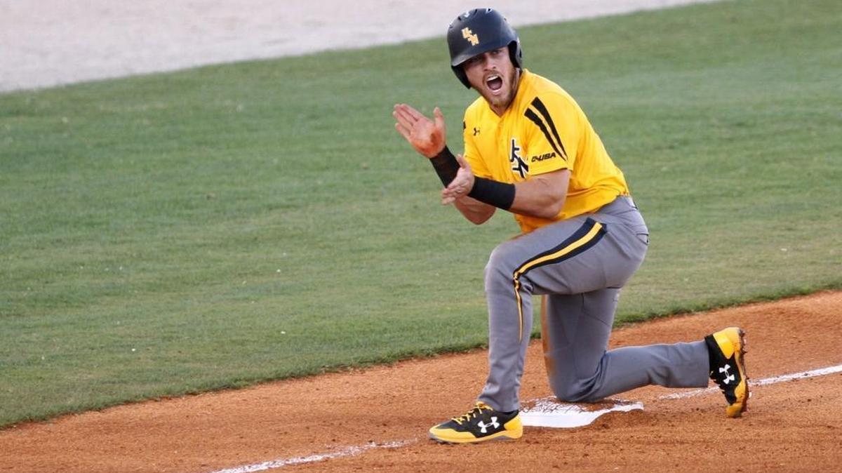 Dylan Burdeaux of Southern Miss fires up his team after making it to third base against UTSA on Friday at MGM Park in Biloxi.
