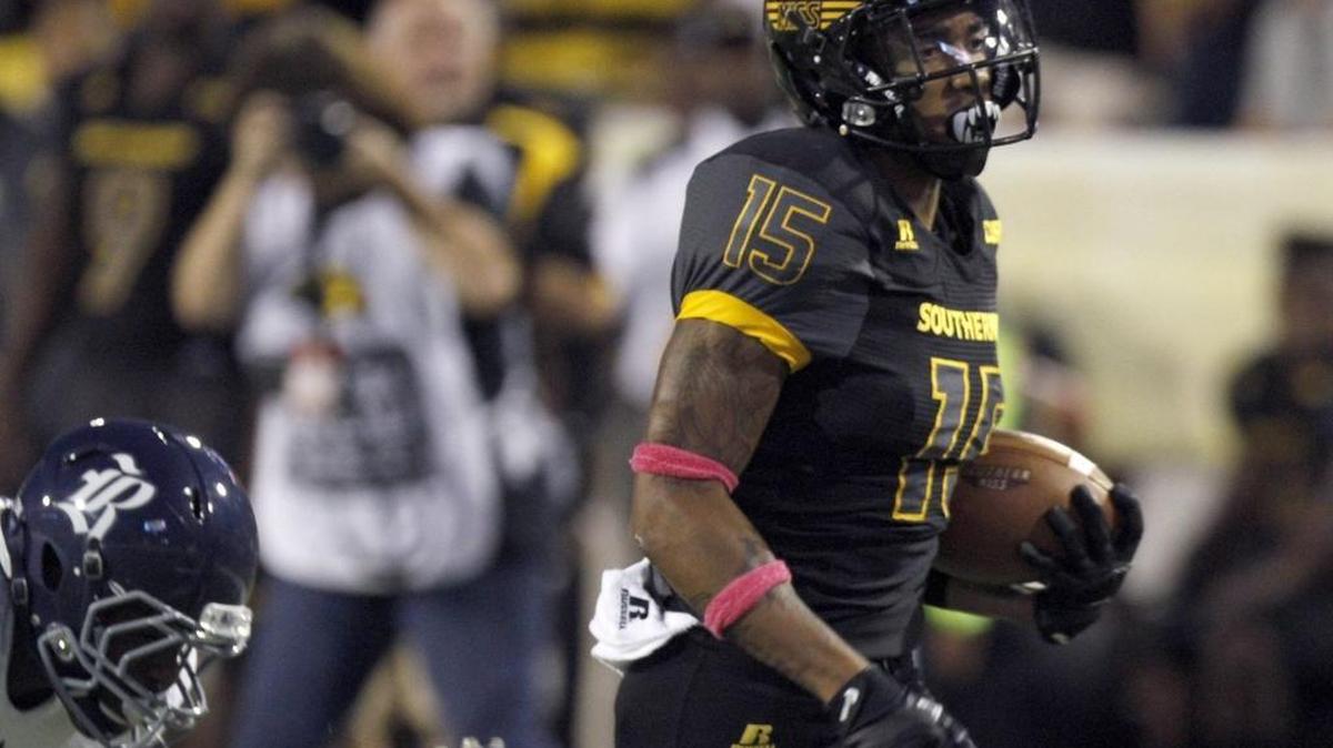 Southern Miss receiver Allenzae Staggers scores a touchdown against Rice after catching a deep pass from Nick Mullens on Oct. 1, 2016, in Hattiesburg.