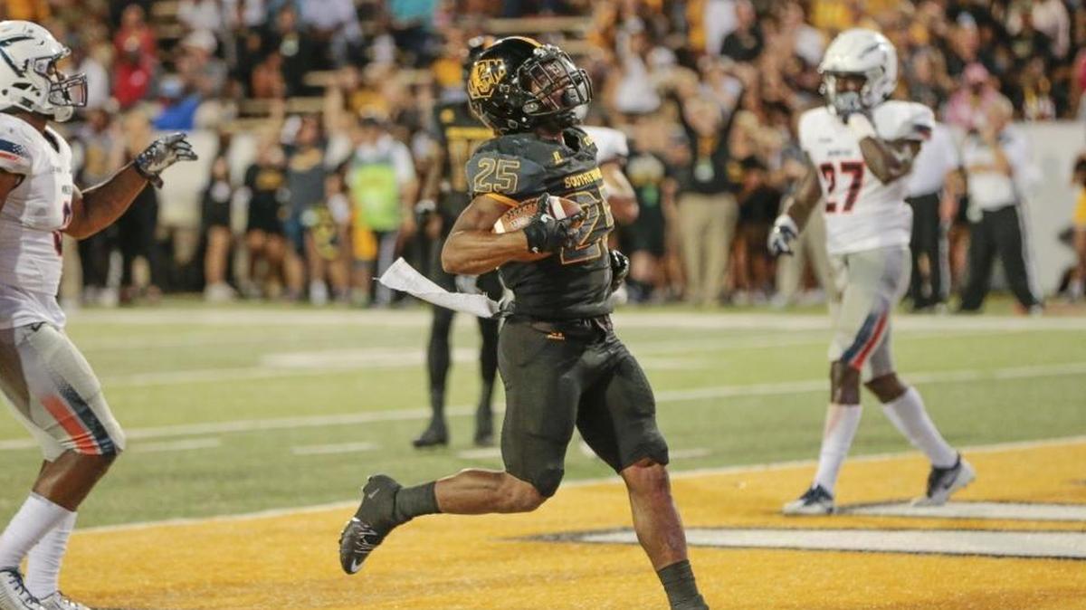 Southern Miss Golden Eagles running back Ito Smith (25) scores his first touchdown of two for the night during the game between Southern Miss Golden Eagles and the UTEP Miners at M.M. Roberts Stadium, Hattiesburg, October 14, 2017.