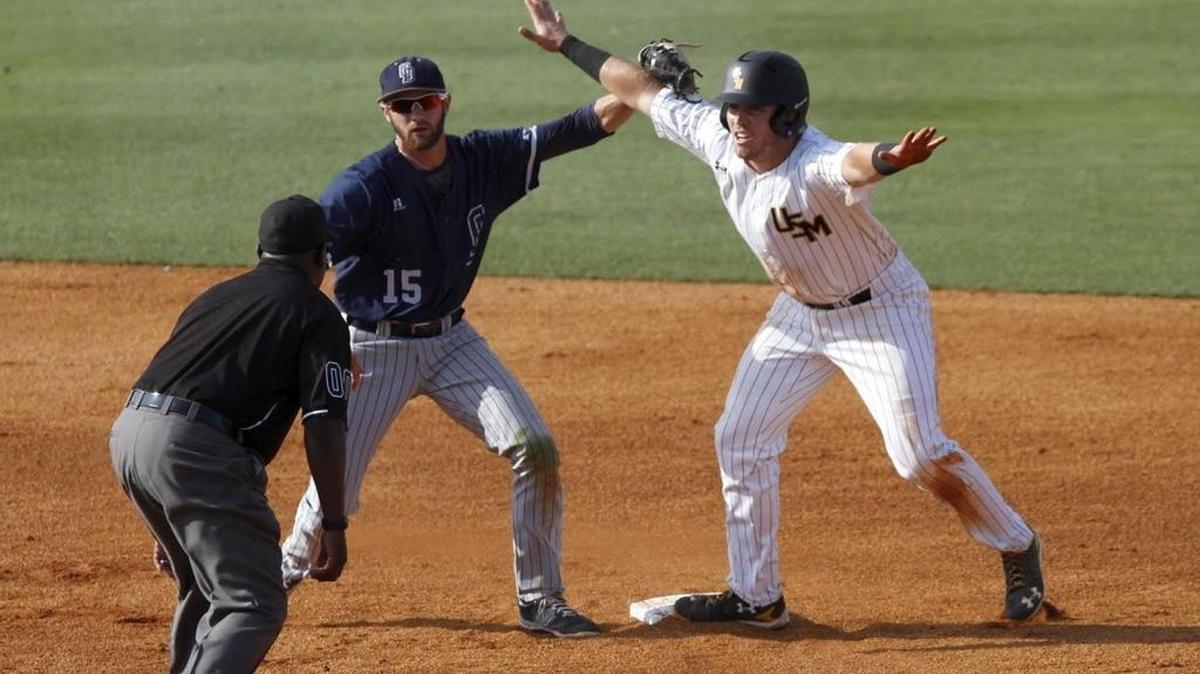 Dylan Burdeaux of Southern Miss called himself safe as Old Dominion shortstop Zach Rutherford makes the tag at Pete Taylor Park in Hattiesburg on May 25, 2016.