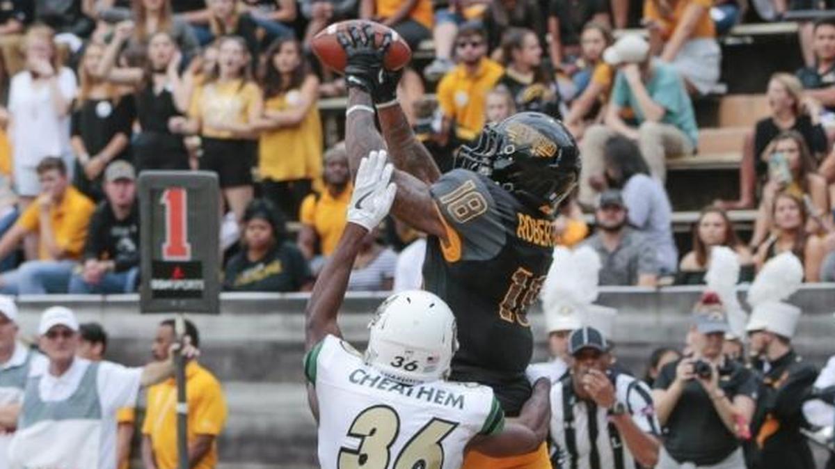 Southern Miss wide receiver Korey Robertson (18) catches a touchdown pass during the game against Charlotte at M.M. Roberts Stadium in Hattiesburg on Nov. 18.