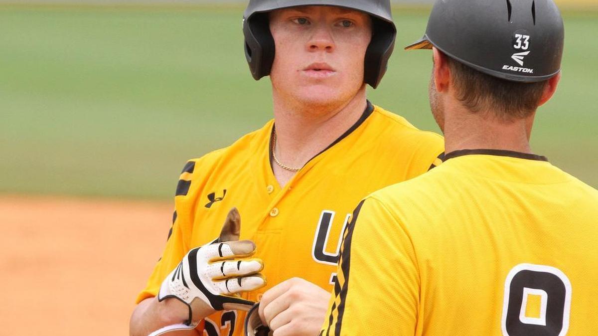 Southern Miss pitcher Taylor Braley talks to assistant coach Chad Caillet after walking against South Alabama during the third inning of their NCAA Regional baseball game at Pete Taylor Park in Hattiesburg on June 4, 2017.