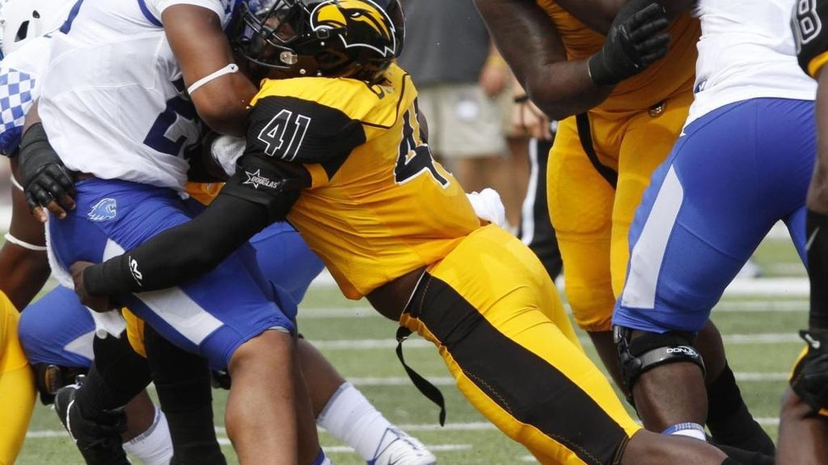 Southern Miss linebacker Racheem Boothe tackles Kentucky running back Benny Snell, Jr. during their game at Roberts Stadium in Hattiesburg on Sept. 2. Boothe is off to a great start on the USM defense.