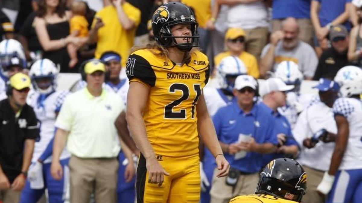 Southern Miss redshirt junior Parker Shaunfield sets up for a field goal try against Kentucky while Reid Rials (81) prepares to take the snap as the holder.
