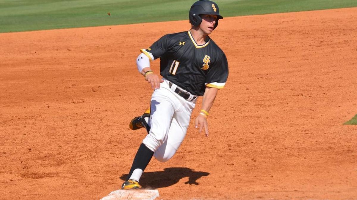 Southern Miss outfielder Mason Irby rounds home to score against FIU Saturday at Pete Taylor Park in Hattiesburg.
