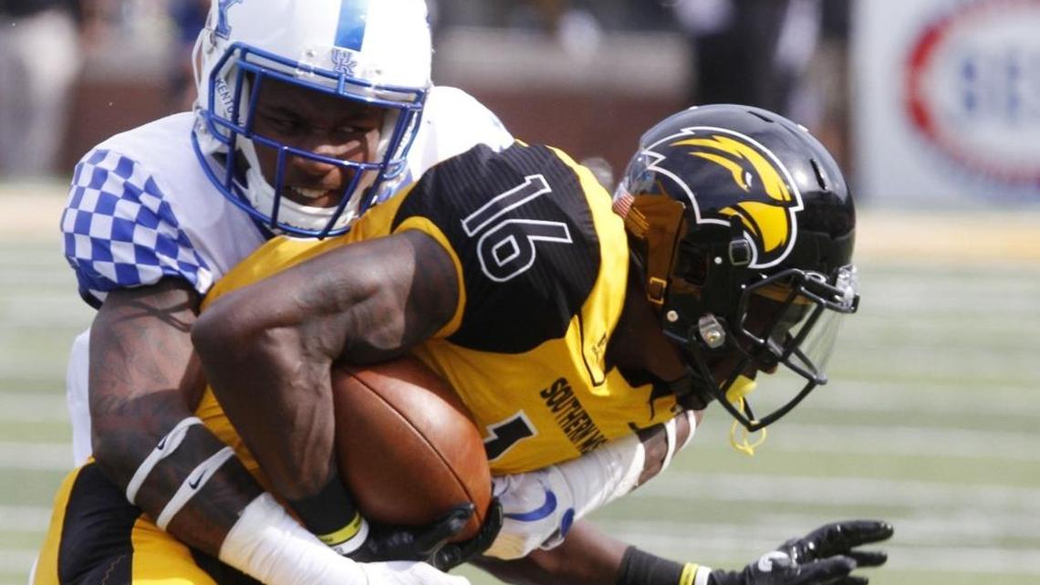 Kentucky cornerback Derrick Baity, Jr. tackles Southern Miss wide receiver Quez Watkins during the second quarter of their game at M.M. Roberts Stadium in Hattiesburg on Saturday.