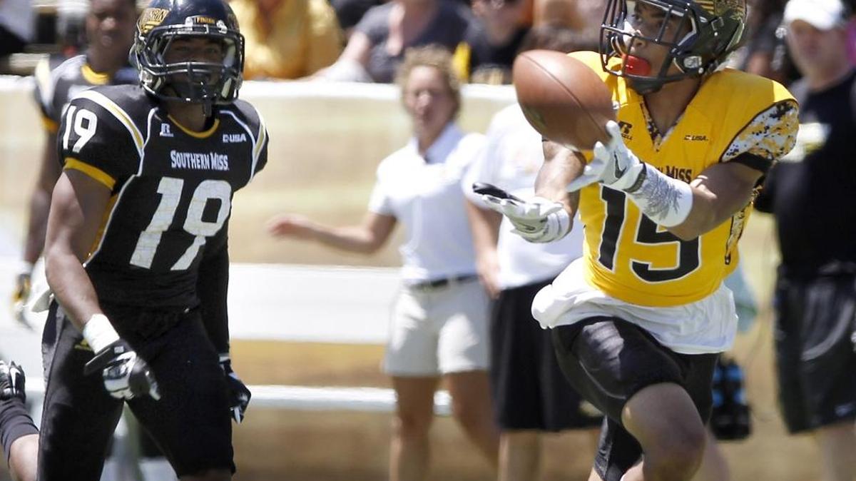 Southern Miss receiver Allenzae Staggers catches a Nick Mullens pass as he beats Curtis Mikell during Black and Gold game on April 23 in Hattiesburg on April 23.