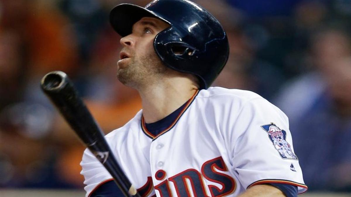 Minnesota Twins' Brian Dozier watches his lead-off home run off Kansas City Royals pitcher Dillon Gee during the first inning of a baseball game Tuesday, Sept. 6, 2016, in Minneapolis.