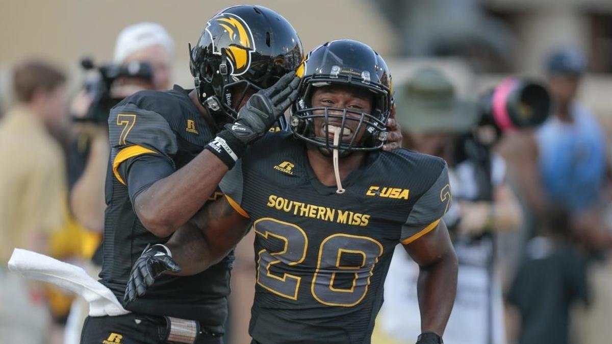 Southern Miss running back T'Rod Daniels (28) is congratulated by quarterback Kwadra Griggs on Sept. 9 in Hattiesburg.