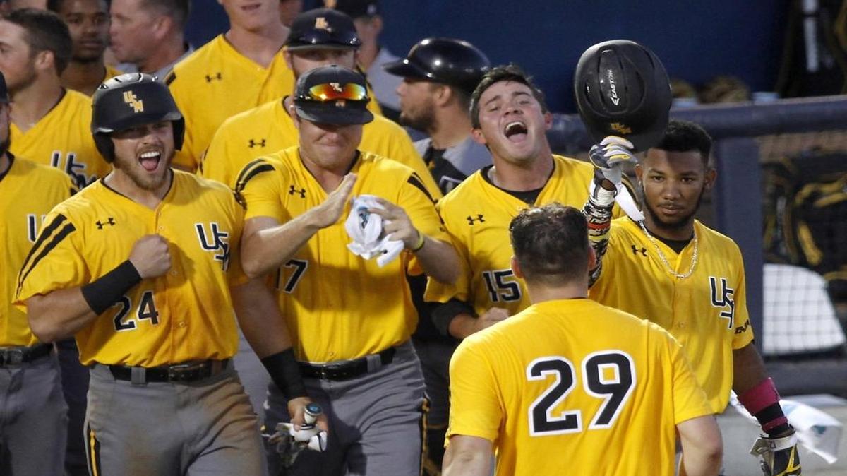 Dylan Burdeaux (left) and his Southern Miss teammates celebrate the home run by Bryant Bowen during USM - UTSA game at C-USA tournament in Biloxi, Friday, May 26, 2017.