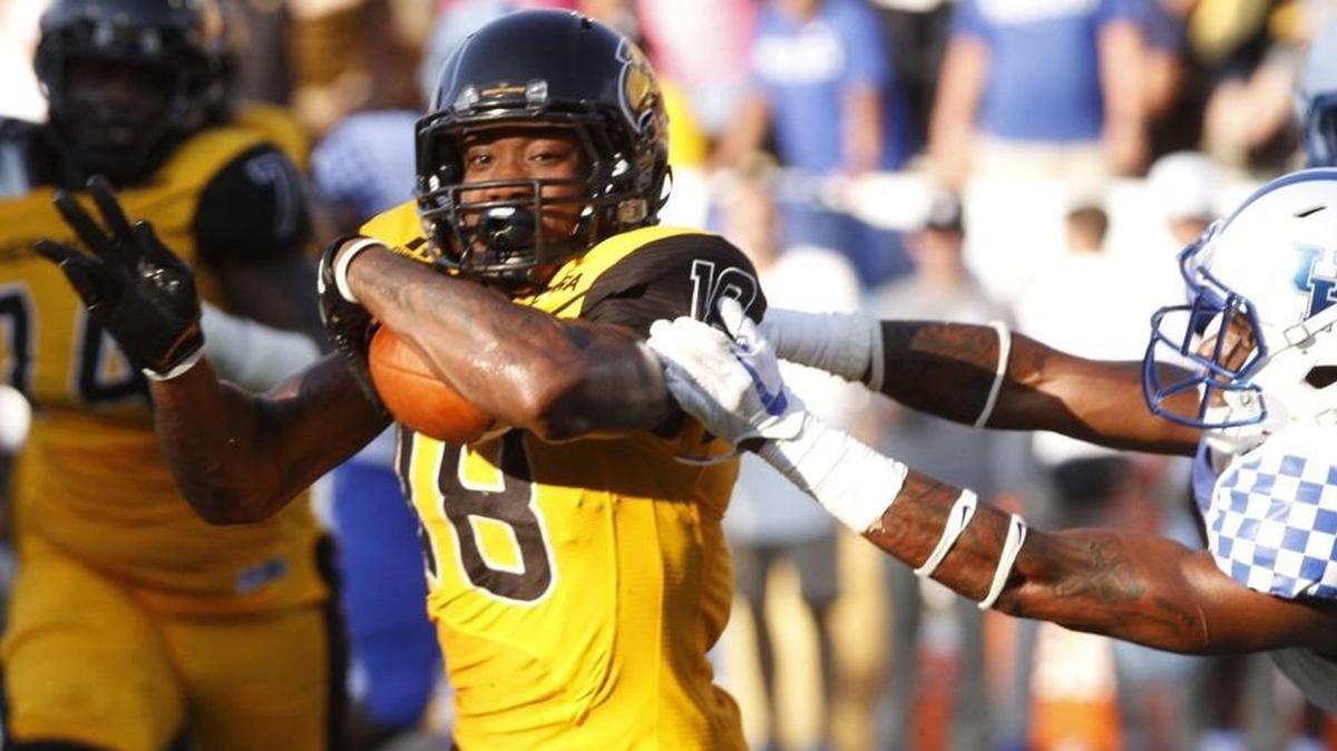 Kentucky cornerback Derrick Baity, Jr. reaches out for Southern Miss wide receiver Korey Robertson during the fourth quarter of their game at Roberts Stadium in Hattiesburg on Sept. 2.