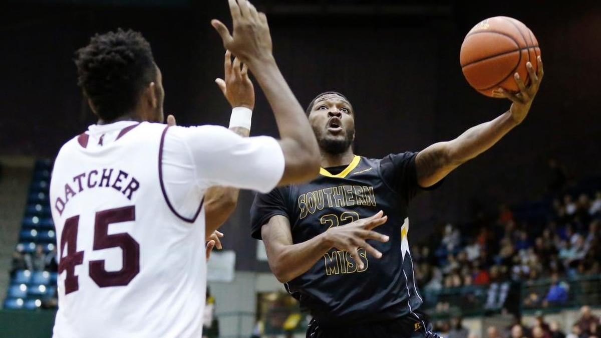 Southern Miss guard Quinton Campbell (22) attempts a shot past Mississippi State center E.J. Datcher (45) in Jackson Monday.