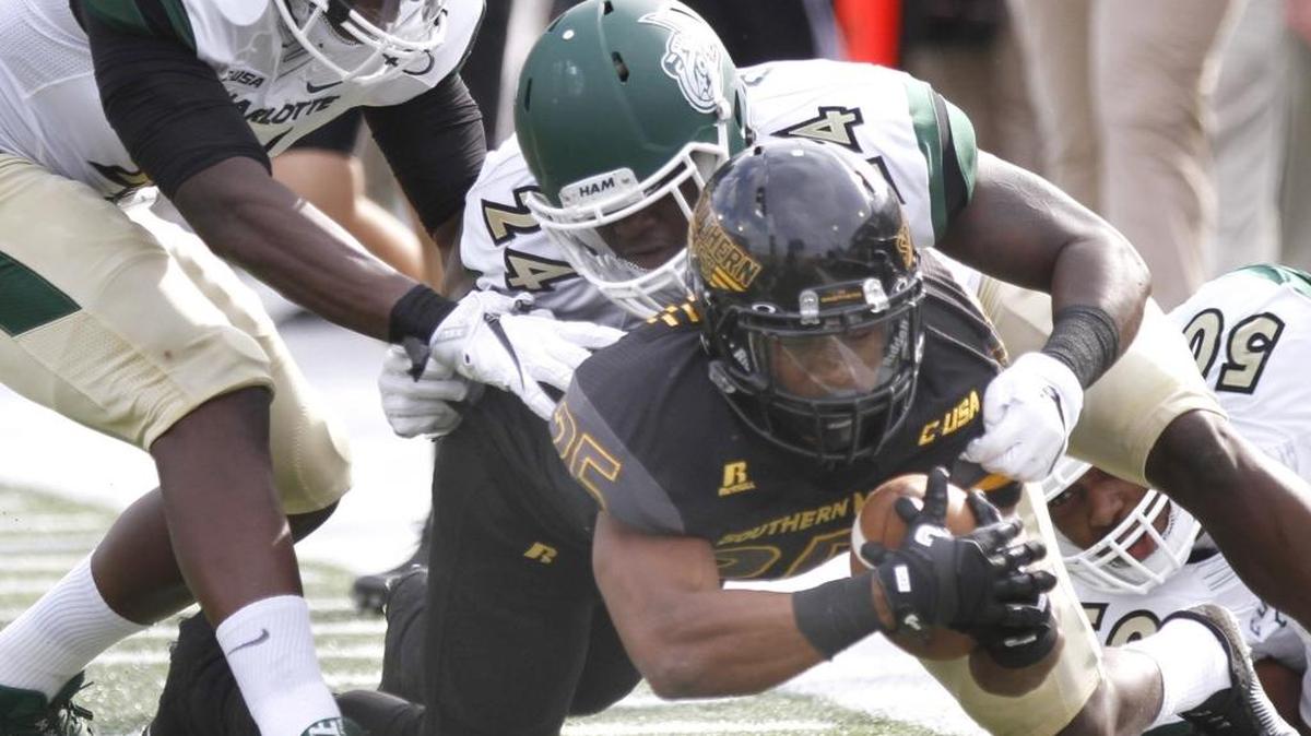 Southern Miss running back Ito Smith tries for a first down against Charlotte at M. M. Roberts Stadium in Hattiesburg on Nov. 5.