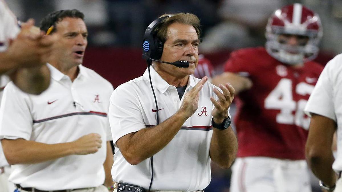 Alabama coach Nick Saban applauds on the sideline during the game against USC on Saturday in Arlington, Texas.