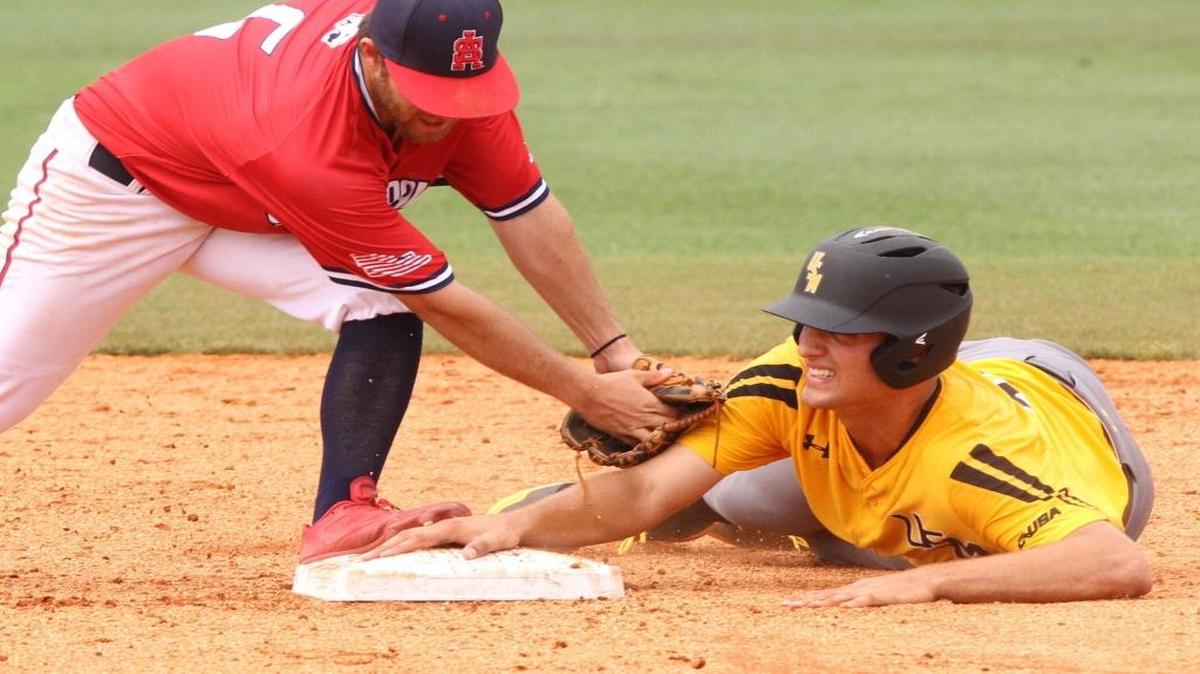 Southern Miss freshman Matt Wallner slides safely into second with a steal as South Alabama's Drew LaBounty's tags during the fifth inning of their NCAA Regional baseball game at Pete Taylor Park in Hattiesburg on June 4.