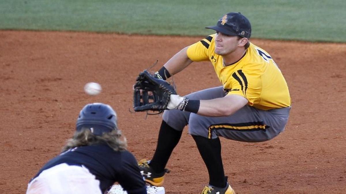 Matthew Guidry of Southern Miss gets the throw as USTA's Kevin Markham is caught stealing during a Conference USA Tournament game at MGM Park in Biloxi on May 26, 2017.