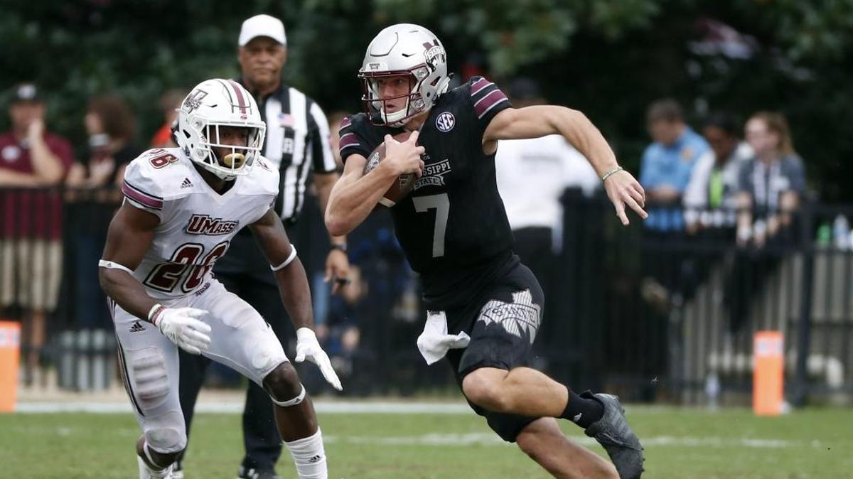 Mississippi State quarterback Nick Fitzgerald (7) runs for a first down past Massachusetts linebacker Jarell Addo (26) in the second half of an NCAA college football game against in Starkville, Saturday, Nov. 4, 2017. No. 21 Mississippi State won 34-23. Fitzgerald was named a finalist for the Conerly Trophy on Monday.