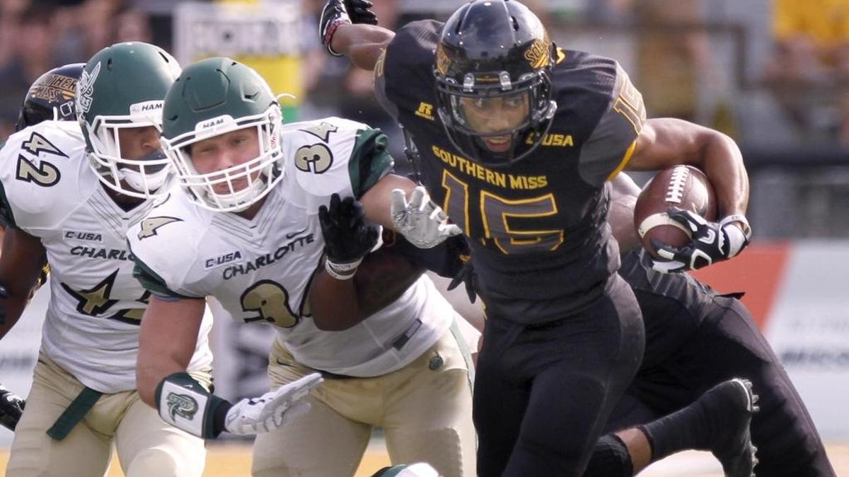 Southern Miss receiver Allenzae Staggers picks his way through the Charlotte defense as Jeff Gemmell and Anthony Butler move in for the tackle at M. M. Roberts Stadium in Hattiesburg, Saturday, Nov. 5, 2016.