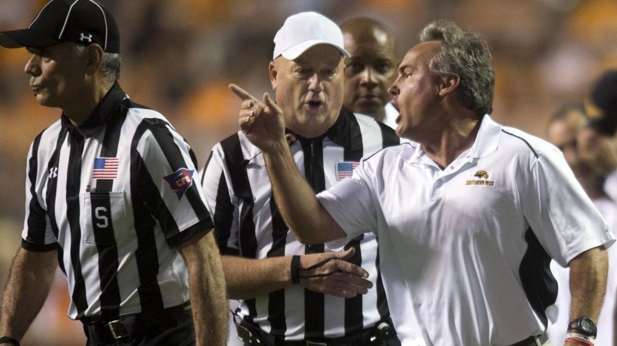 Southern Miss head coach Jay Hopson exchanges words with game officials during the game against Tennessee in Knoxville, Tenn., Saturday.