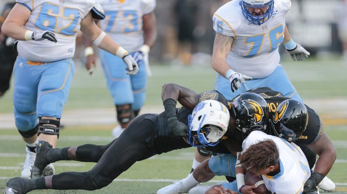 Southern Miss Golden Eagles defensive lineman Xavier Thigpen (32) sacks Southern University Jaguars quarterback Glendon McDaniel (12) on Saturday in Hattiesburg.