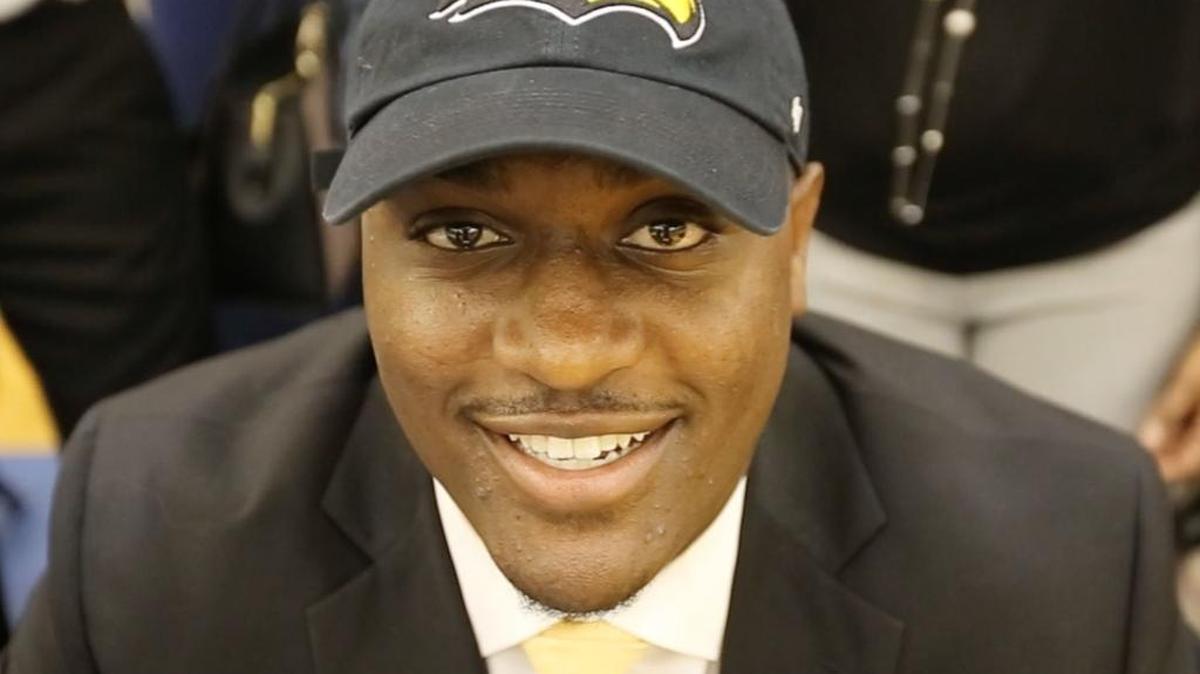 Gautier High School offensive lineman Paul Gainer sports a Southern Miss cap after announcing that he will play football there during a ceremony at the school on Wednesday.