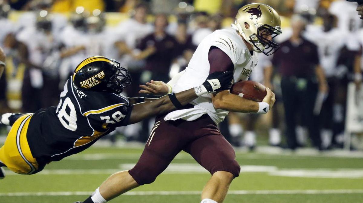 Southern Miss defensive lineman Jerry McCorvey attempts to tackle Texas State quarterback Tyler Arndt on Aug. 31, 2013, in Hattiesburg. McCorvey, a Vancleave native, has battled through injuries and appears set to make an impact on the USM defensive line this year.