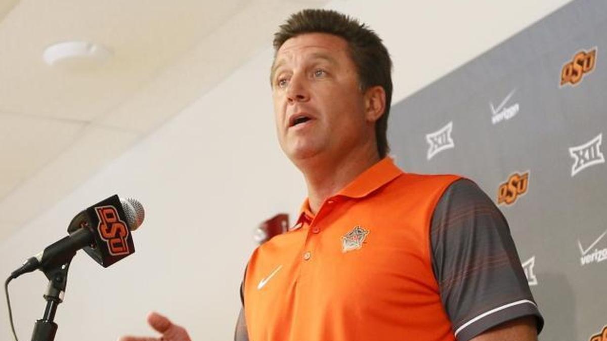 Oklahoma State coach Mike Gundy, who is speaking to media in 2016 in this picture, went before the local school board in Stillwater, Oklahoma, and wanted to know what type of security was available in the schools.