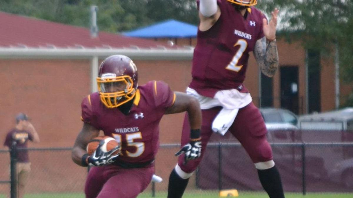 Pearl River quarterback Justin Agner fakes a pass after handing off to running back Ron Thompson during action Thursday at Poplarville.