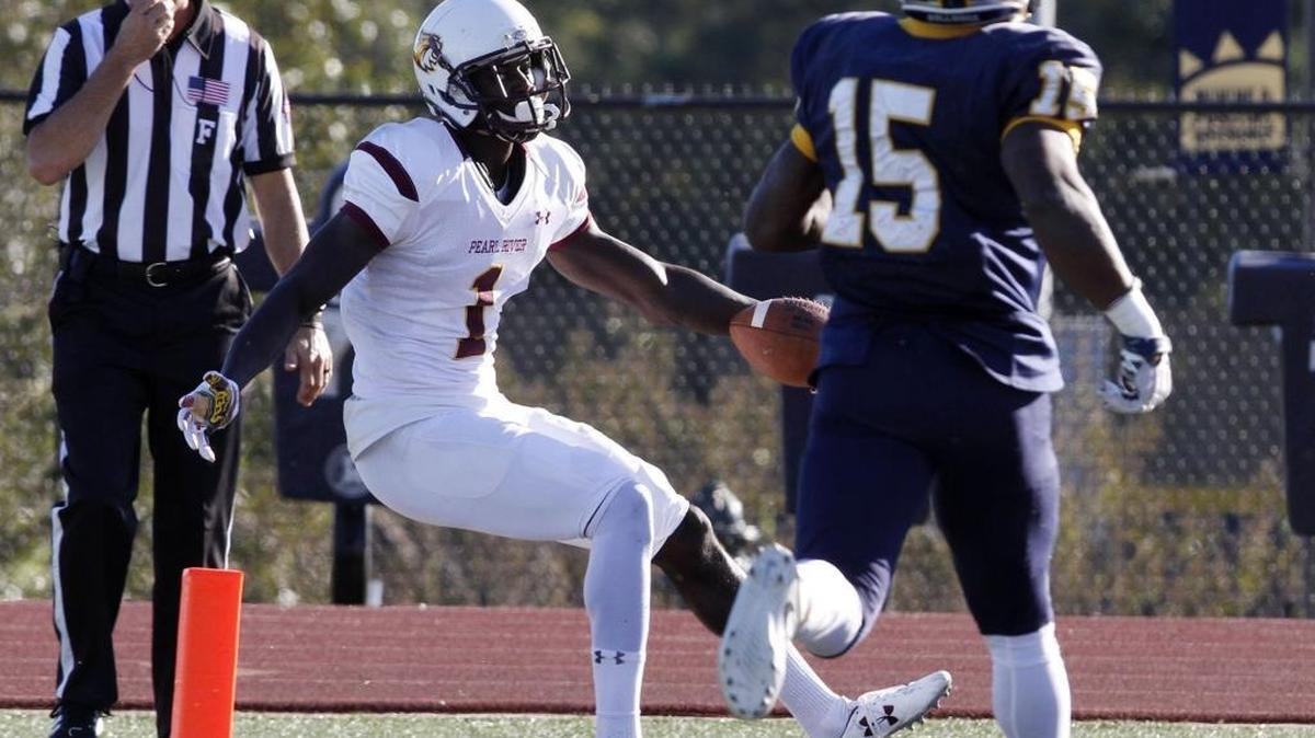 PRCC wide receiver Matthew Eaton dances his way into the end zone as MGCCC defensive back Vaughnte Dorsey gives chase during the second quarter of their game at A.L. May Stadium in Parkinson on Saturday Oct. 22, 2016.