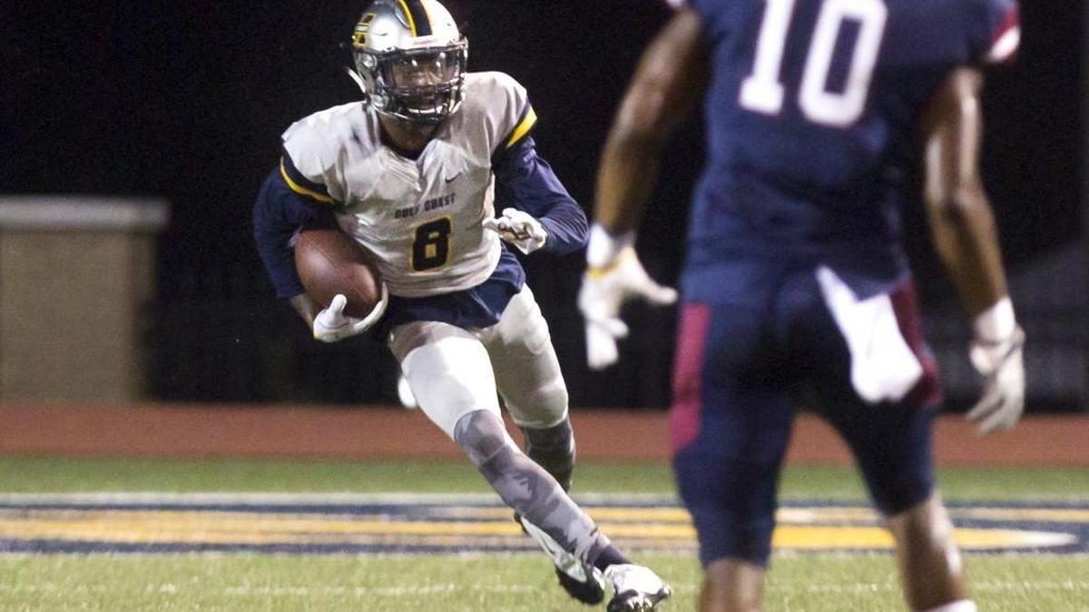 Mississippi Gulf Coast Community College's Saivion Smith runs the ball while Southwest Mississippi Community College's Toby Jones, 10, waits for him to approach on Thursday, October 12, 2017, in Perkinston.