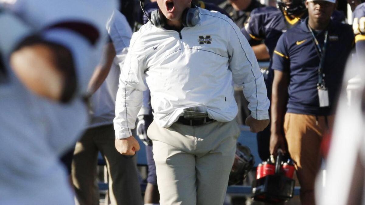 MGCCC head coach Chad Huff yells at his players during the second quarter of their game against PRCC at A.L. May Stadium in Parkinson on Saturday Oct. 22, 2016. The Bulldogs announced a 38-player signing class on Wednesday.