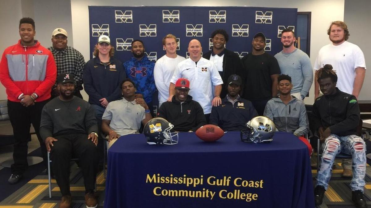 Mississippi Gulf Coast had 14 players sign with Division I schools on Wednesday and expect to have several more land on the next level in the coming days. Pictured (clockwise, from top left) are D’Marcus Hayes (Georgia), Rishard Cook (UAB), Joshua Rowland (Texas), Reggio Dean (Central Arkansas), Tyler Flathau (Arkansas State), coach Chad Huff, Randan Knight (Mississippi College), Justin Stewart (Mississippi College), Carson Jordan (Western Kentucky), Kevin Haas (Ohio), Brandon Martin (Arkansas), Jonathan Nance (Arkansas), Lester Wells (Central Arkansas), Vaughnte Dorsey (Texas Tech), Jay Jay Smith (Texas-San Antonio) and Isaiah Buggs (Alabama).
