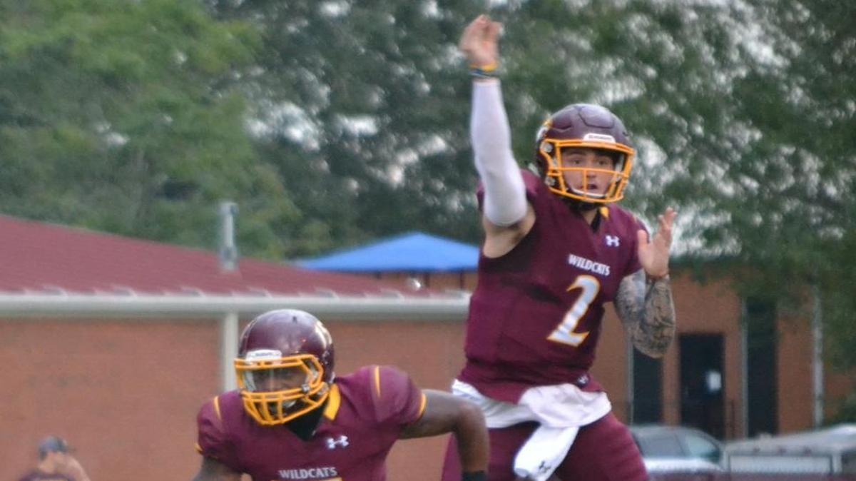 Pearl River Community College quarterback Justin Agner fakes a pass after handing off to running back Ron Thompson against Northeast last week.
