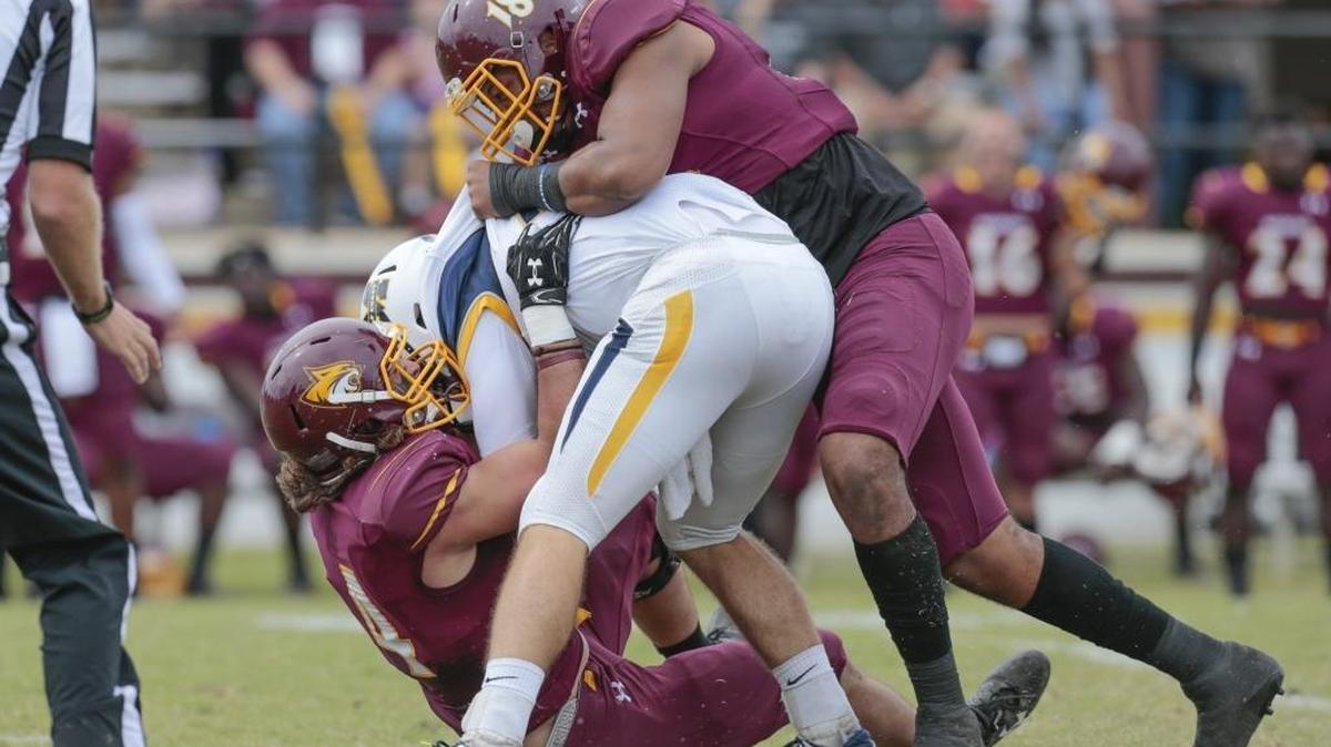 Pearl River Community College defensive lineman Korbin Harmon assists on a tackle of Mississippi Gulf Coast Community College quarterback Larry Sisson during their game at Poplarville, Saturday, October 21, 2017.