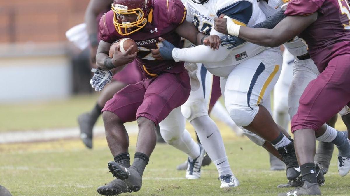 Running back Caleb Batie runs into a wall of MGCCC player. Batie signed with Missouri Southern State.