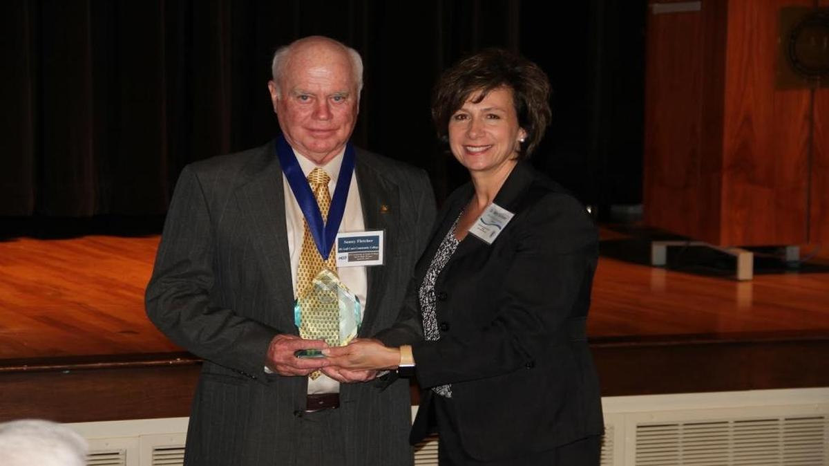Former Mississippi Gulf Coast Community College football standout Sonny Fletcher, pictured with MGCCC President Mary Graham, was inducted into the MACJC Sports Hall of Fame class.