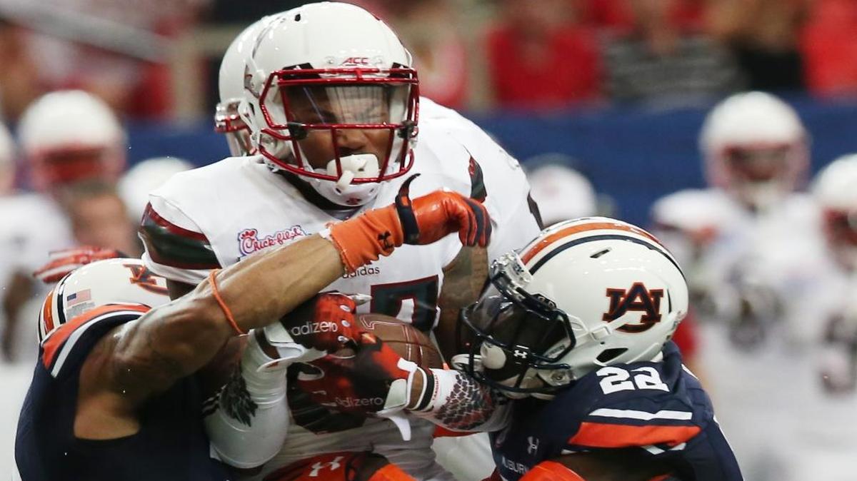 Louisville wide receiver Jaylen Smith (87) is hit by Auburn defensive back Tim Irvin (22) on Sept. 5, 2015, in Atlanta.