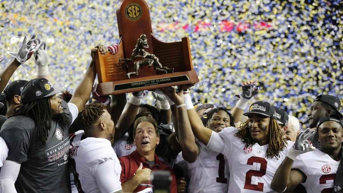 Alabama team members celebrate after the Southeastern Conference championship NCAA college football game against Florida in 2016. Alabama is the oddsmakers’ favorite to win the SEC again this season.