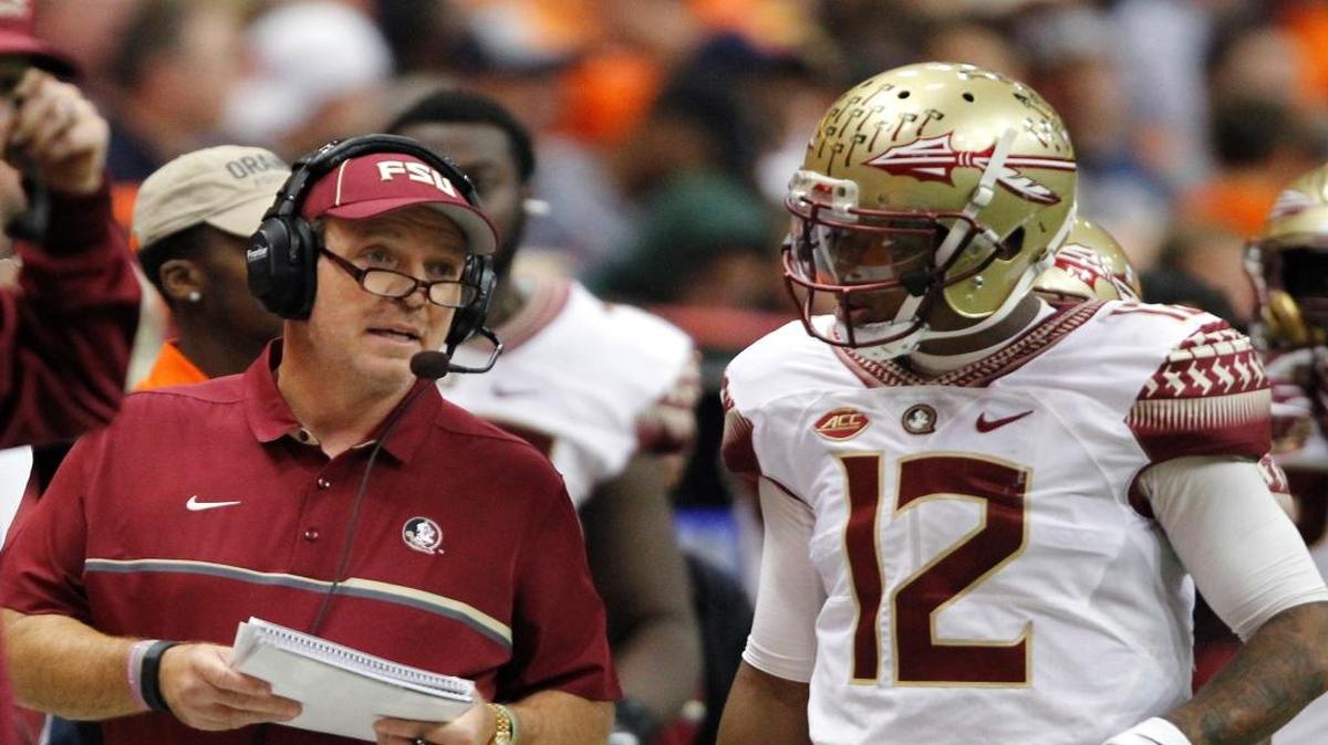 Florida State head coach Jimbo Fisher, left, talks with Deondre Francois, right, in the third quarter of an NCAA college football game against Syracuse in Syracuse, N.Y., Saturday, Nov. 19, 2016.