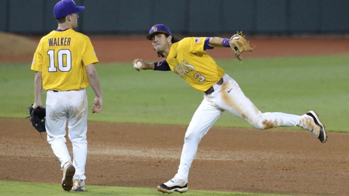 LSU shortstop Kramer Robertson, 3, attempts to throw a ball hit by Rice catcher Dominic DiCaprio that hit LSU starting pitcher Eric Walker, 10, in the glove in the ninth inning of Game 6 of the 2017 NCAA Baton Rouge Regional between LSU and Rice on Sunday, June 4, 2017, at Alex Box Stadium. LSU shut out Rice 5-0.