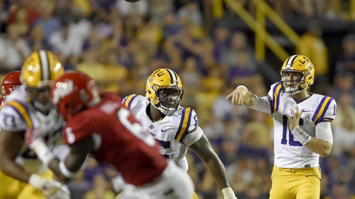 LSU QB Danny Etling (16) throws as LSU offensive tackle Toby Weathersby (66) blocks during Saturday's win over Jacksonville State in Baton Rouge, La.