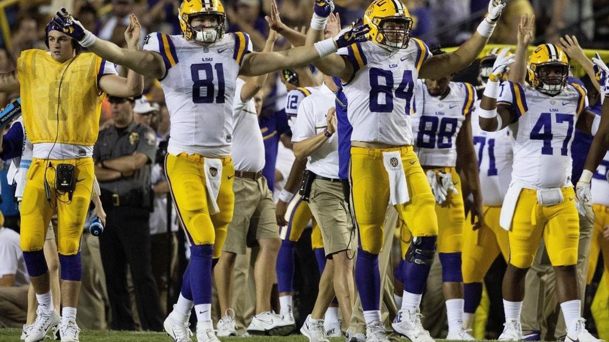 LSU tight ends Colin Jeter (81) and Foster Moreau (84) celebrate the time winds against Missouri in Baton Rouge, La., Saturday.
