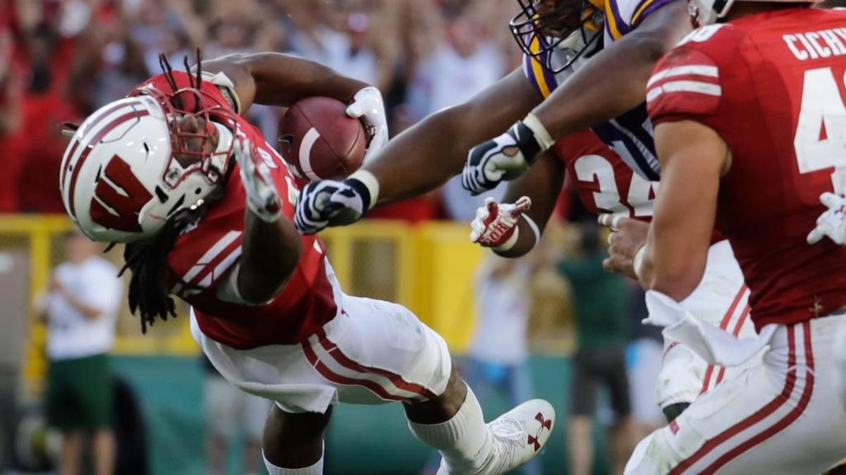 LSU's Josh Boutte hits Wisconsin's D'Cota Dixon after Dixon intercepted a pass during the second half of an NCAA college football game Saturday, Sept. 3, 2016, in Green Bay, Wis. Boutte was ejected from the game on the play. Wisconsin won 16-14.