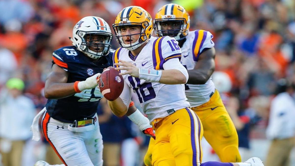LSU quarterback Danny Etling (16) scrambles for yardage against Auburn, Saturday in Auburn, Ala.