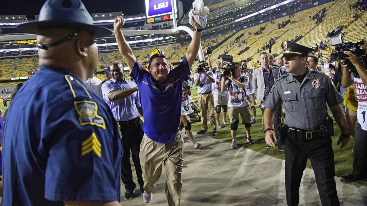 LSU interim coach Ed Orgeron waves to the crowd as he leaves Tiger Stadium in Baton Rouge after a 42-7 victory against Missouri on Oct. 1.