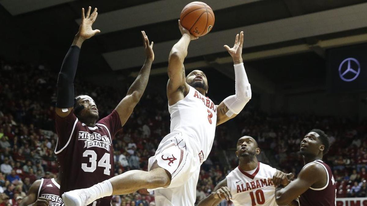 Alabama guard Corban Collins (3) gets off a shot in the lane against Mississippi State center Schnider Herard (34).